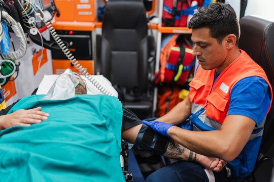 paramedic treating a patient in the ambulance.