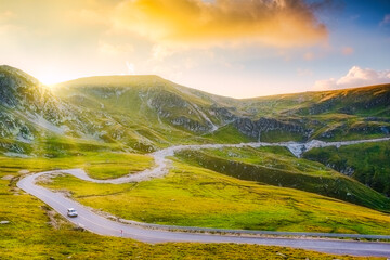 Carpathian mountain peaks crossed by Transalpina road on a sunny summer morning at sunrise, at Urdele pass, in Gorj county, Romania - 753808604