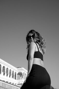 Black and white photo of a woman outdoors