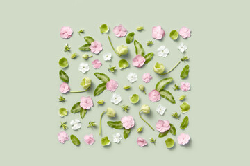 Square frame created with spring flowers, buds and leaves