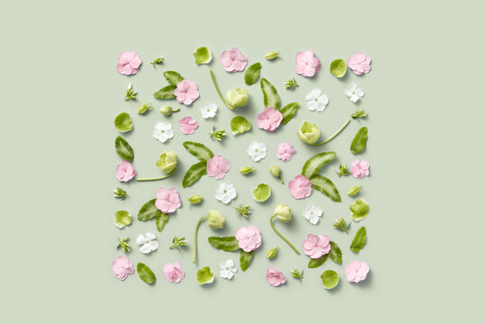 Square frame created with spring flowers, buds and leaves