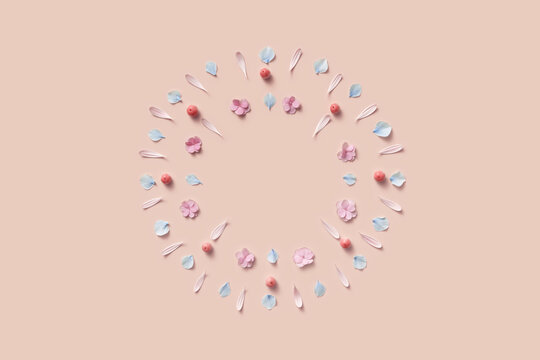 Festive frame of circle shape made of various flower petals