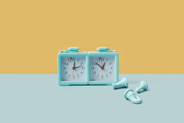 Blue chess clock with figures of pawn, queen and knight