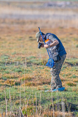Researcher, scientist who takes photographs and collects samples in the field.