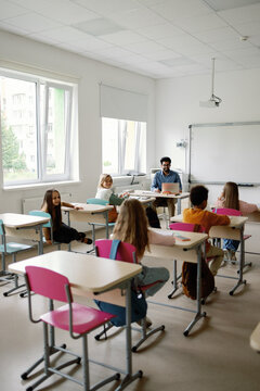 Elementary school auditorium students education listening