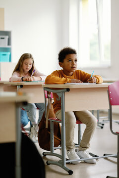 Classmates listening carefully desks modern auditorium 