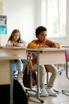 Schoolchildren educational system writing task education classroom 