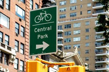 Traffic lights and signs in Central Park, a public urban park located in the metropolitan district of Manhattan, in the Big Apple of New York City in the United States of America.