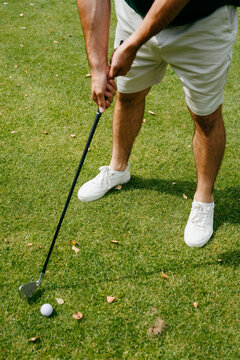 A man plays golf on a course