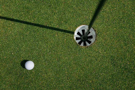Golf ball near the hole
