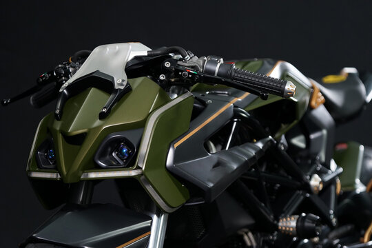 Custom handmade motorcycle cafe racer style with green matte color inspiration from super car design