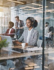 Blurred office with people working behind glass wall 