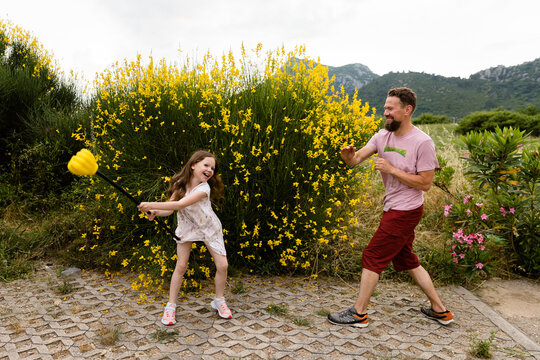 Child and man fight for fun