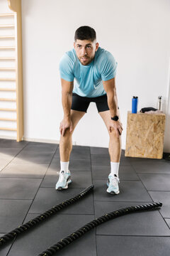 Image of a male resting during a gym workout