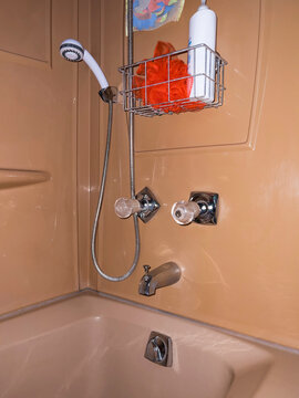 Shower Environment with vintage brown wall plumbing fixture