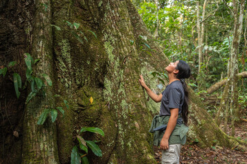 Woman touching a tree