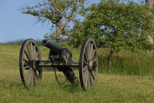 10 pounder Parrott riffled cast iron artillery piece model 1861 at Gettysburg. Battlefield in the background