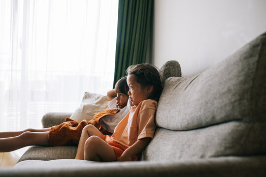 Children sitting on the couch