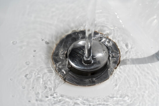Water flows into the sink hole