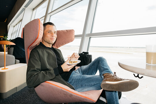 Man Sitting in Airport Lounge