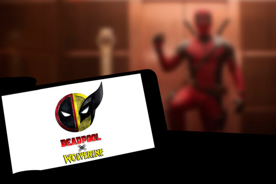 Logo of Deadpool and Wolverine movie on phone screen