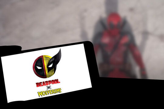 Logo of Deadpool and Wolverine movie on phone screen
