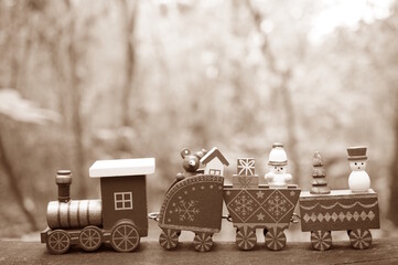 A toy Christmas train with toys. Sepia effect. Tinted image.