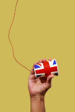 man holding a british string telephone