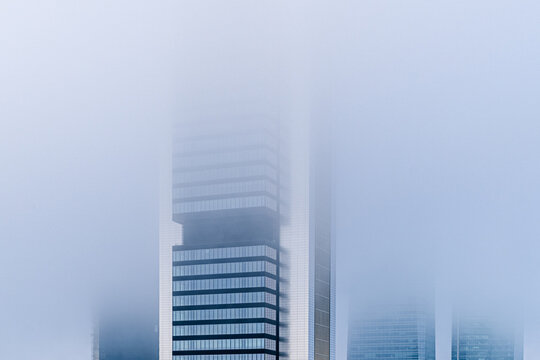 Foggy Day Among Skyscrapers in Urban Landscape. Cityscape in Mist