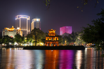 Awesome night view of the Hoan Kiem Lake (Lake of the Returned Sword) and the Turtle Tower at...