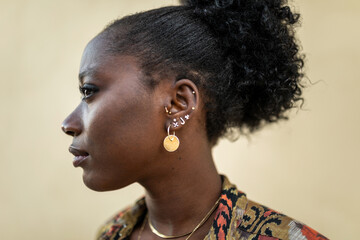 portrait of elegant black woman on a yellow background