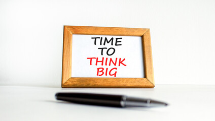 Time to think big symbol. Concept words Time to think big on beautiful white wooden frame. Black pen. Beautiful white background. Business and time to think big concept. Copy space.