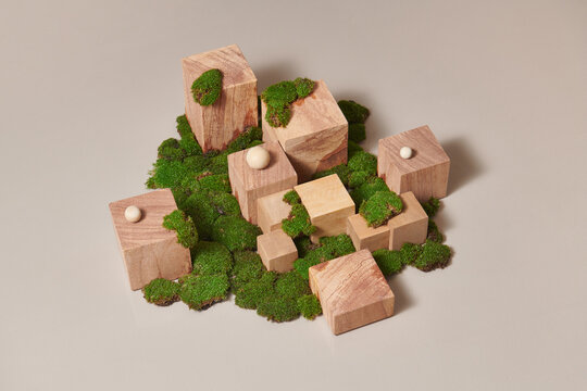 Wooden scenes of different geometric shapes on a beige background. 