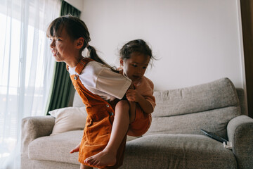 Sister carrying sister