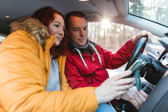 Family looking at navigation map