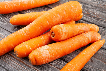 carrots heap on wood background