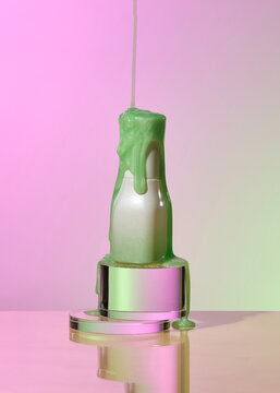 Drops of water flow down the low bottle green cosmetics
