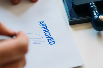 Man Signing Approved Document