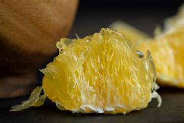 peeled slices of ripe and juicy orange close-up