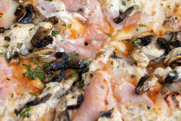 a slice of pizza with mushrooms and meat in sauce