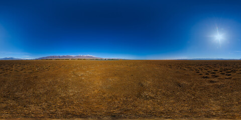seamless 360 by 180 degree spherical panorama of mountain lake Issyk-Kul shore at sunny autumnal day