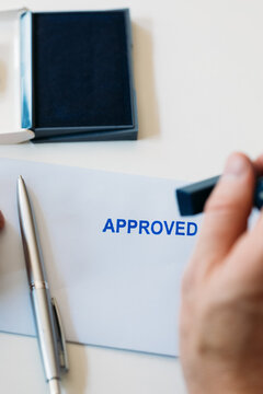 Man Signing Approved Document