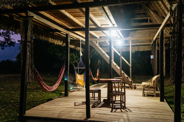 Jungle Wooden Cabin at Night