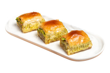 Turkish baklava. Mediterranean cuisine flavours. Pistachio baklava isolated on white background, ramadan or holiday desserts concept. Close up
