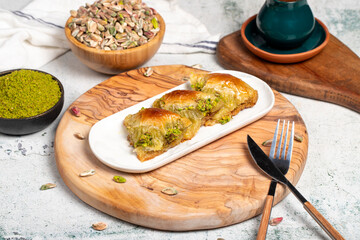 Pistachio şöbiyet baklava. Turkish and Arabic cuisine delicacies. Şöbiyet baklava with clotted...