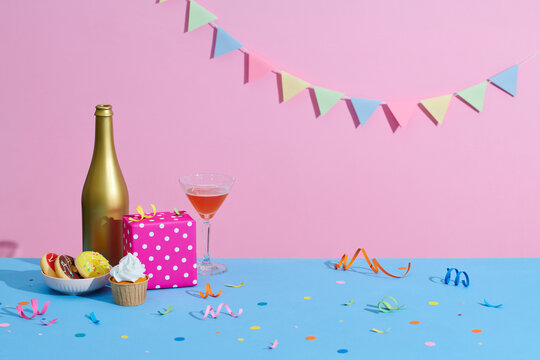 Birthday cupcake background with birthday gift, birthday party hat