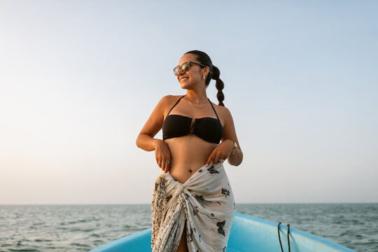 Woman looking away standing in bow