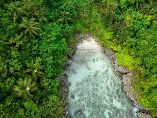 Beautiful ocean waves splashing on rocky shoreline. San Jose, Romblon. Philippines.