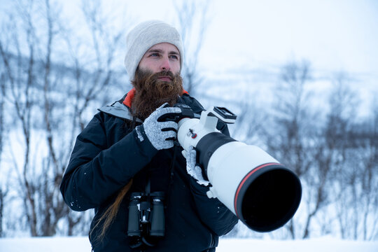 Wildlife photographer in a snowy landscape