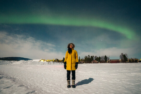 Woman looking up auroras